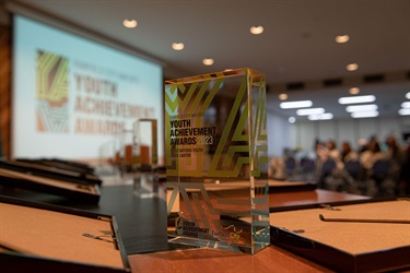 Close up of the Youth Achievement Awards trophy