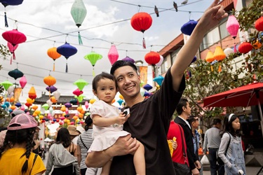 Daughter and dad posing with lanterns at Cabramatta Moon Festival 2025 photo by Ken Leanfore.