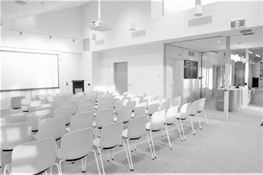 Community-Space-room-in-Fairfield-City-HQ-with-boardroom-style-chairs-and-projector.jpg