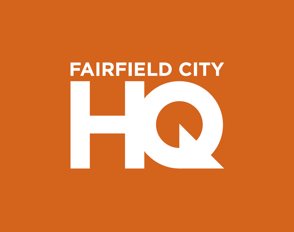 Fairfield City HQ white logo on orange background