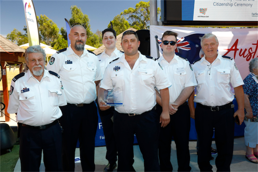 Horsley Park Rural Fire Bridge standing together holding 2021 Fairfield City Volunteer of the Year award