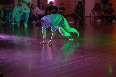 Guests watching young man break dancing at Prairiewood Youth Centre. Photographed by Jacob Stevens-Pozlewicsz