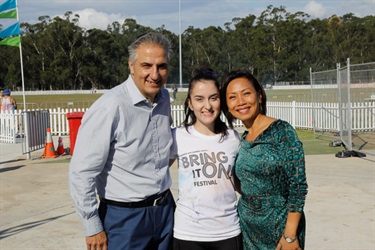Mayor Frank Carbone and Councillor Dai Le posing with young woman
