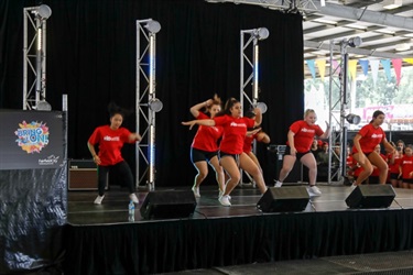 Young girls performing a dance on stage