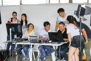 Bring It On! Festival Film Crew Volunteers looking at computer screens