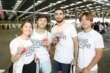 Young friends posing and holding their cool drinks