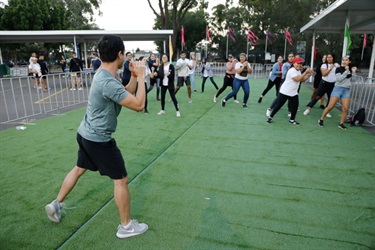 Zumba instructor showing young people the choreography