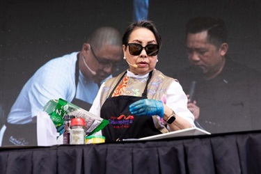 Angie Hong cooking on stage