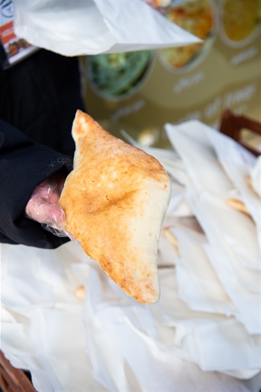 Person holding a free bread sample
