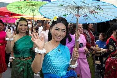 Dancers from Cambodian Dance group wave to the crowd as they take part in Fairfield City Council’s Culinary Carnival Street parade.