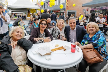Mayor Frank Carbone posing with family sitting around table