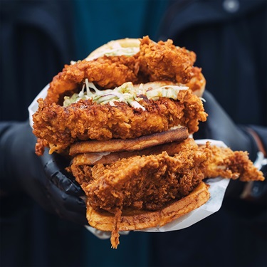 Stacked fried chicken burgers from El's Fried Chicken