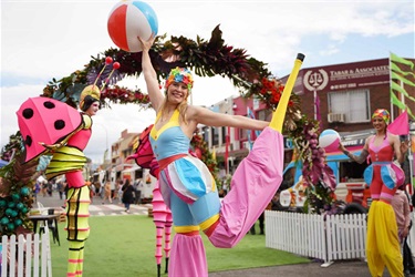 Performers on stilts roving around site at Fairfield Spring Fest 2022