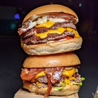 Stacked hamburgers at Mr Pig