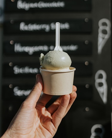 Cup of gelato with a spoon in it at Mr Goaty Gelato