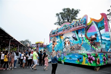 People line at an amusement ride