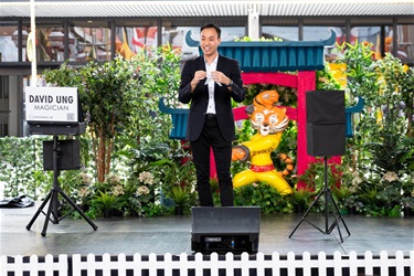 David Ung the Magician performing on stage