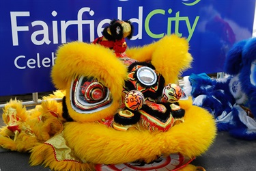 Yellow lion dancing puppet head lying on the floor