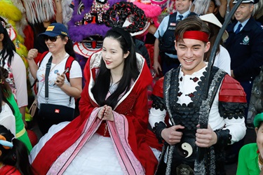 Young woman and man dressed as the Chinese Moon Goddess and Archer