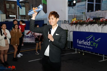 SBS Pop Asia Host Andy Trieu smiling while speaking into a microphone