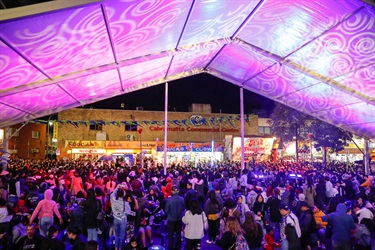 Crowd of guests waiting for lion dancers to perform on stilts