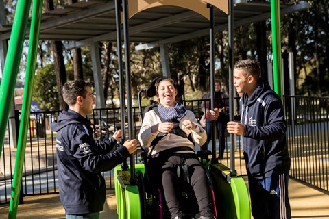 Young girl using the liberty swing at Deerbush Park Opening