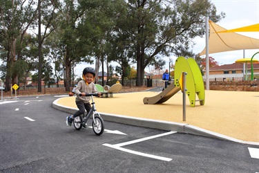 Toddler riding his push bike at Deerbush Park