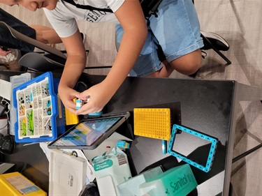 Young boy building lego