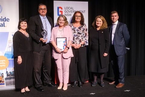 General managers and manager of Communications and Marketing team accepting their Dougherty award 2022