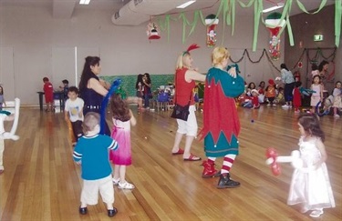 Adults and young children celebrating Christmas at Wetherill Park Community Centre and Hall