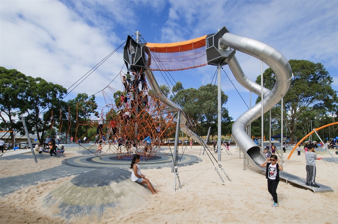 Climbing nets and slides over the sand pit at Fairfield Adventure Park