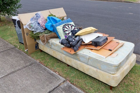 Large household waste items sitting on road side waiting for kerb side clean up