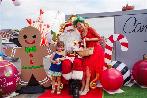 Santa posing with little girl at 2023 Canley Heights Children's Christmas