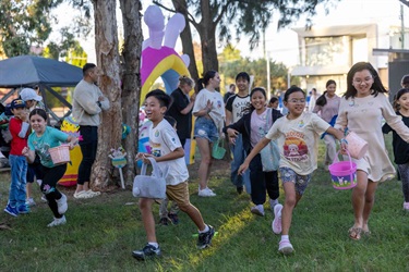 Kids hunting for Easter Eggs at Bareena Park in Canley Vale.