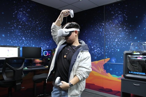 Young man using virtual reality headset