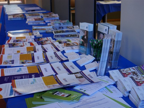 Table displaying various flyers and booklets