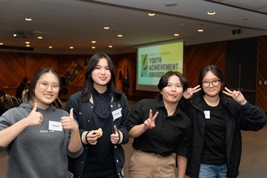 A group of young people posing for a photo.