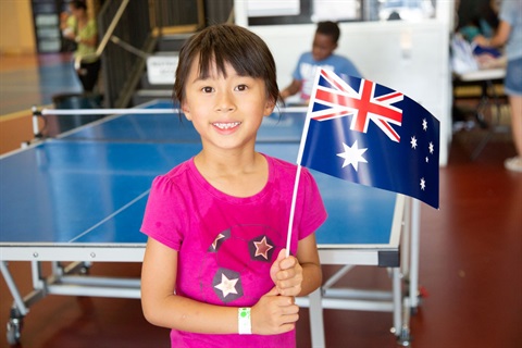 little girl holding Australian flag on Australia day