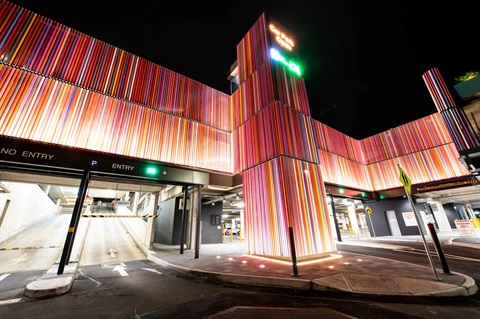 Dutton Plaza carpark entrance at night viewed from outside the building