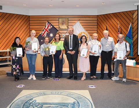 group shot with the mayor at the council meeting