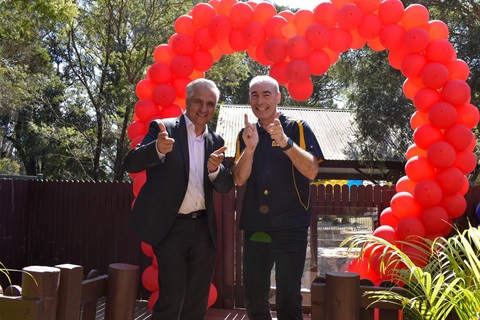 Yellow wiggleposing next to Mayor Frank Carbone