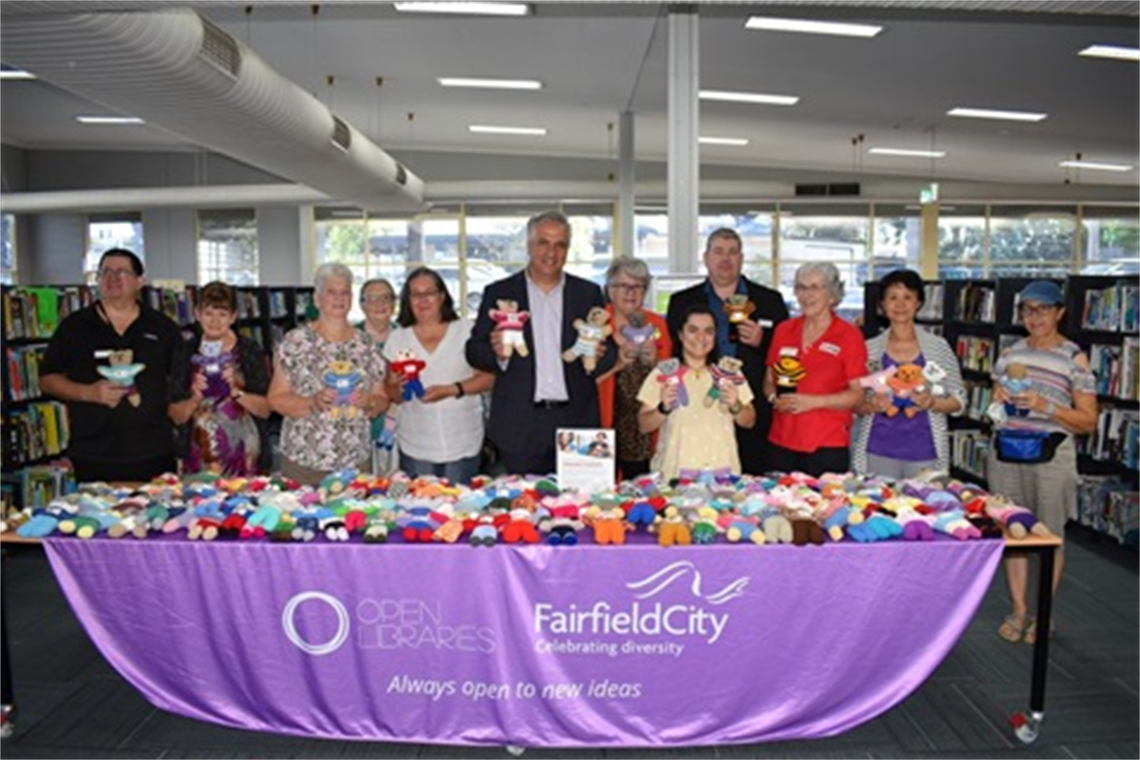 Mayor Frank Carbone trauma teddy hand over.png