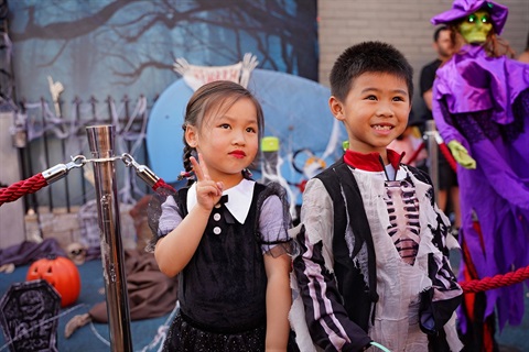Two children dressed up in Halloween costumes at the Canley Heights Halloween party on 28 October 2023