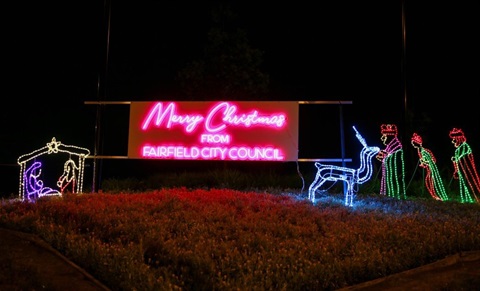 Neon sign of nativity scene which says Merry CHris tmas from Fairfield City Council