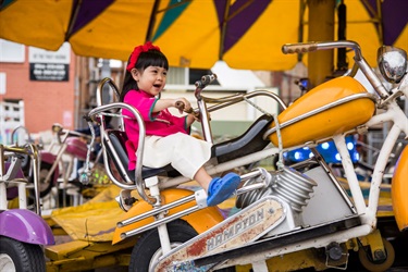 A kid on a motorbike ride