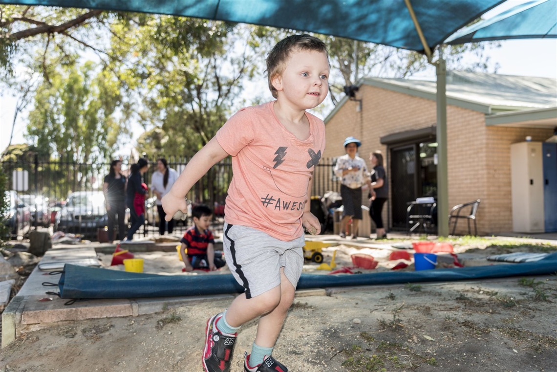 Young boy in play area 