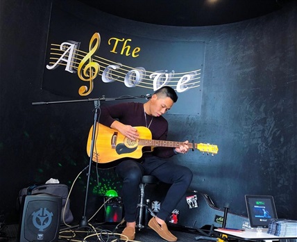 Mark Flores performing in the Alcove at Whitlam Library