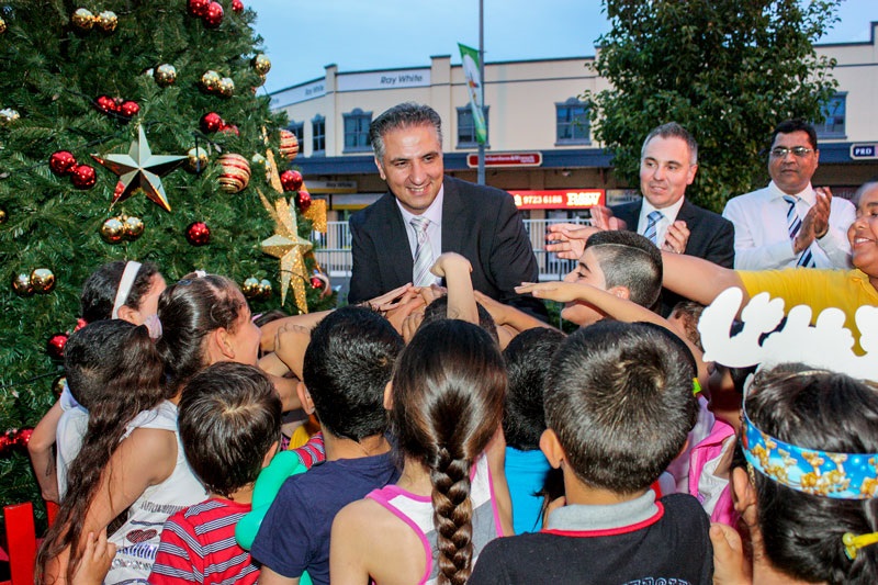 Mayor Carbone turning on the Christmas tree lights at Epoch Plaza.