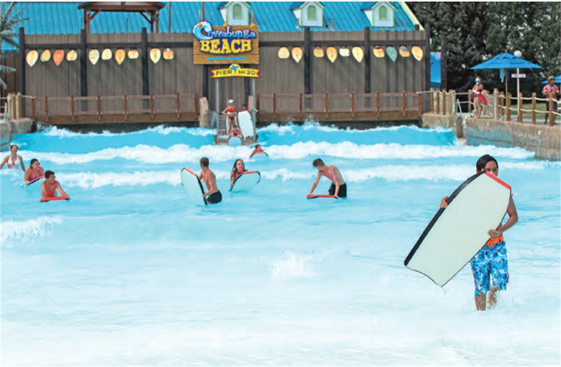 Guests riding boogie boards in the new wave pool at Aquatopia 