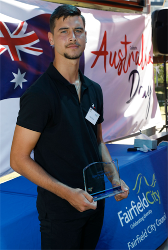 Aleks Duricic holding 2021 Fairfield Sports Achiever of the Year award